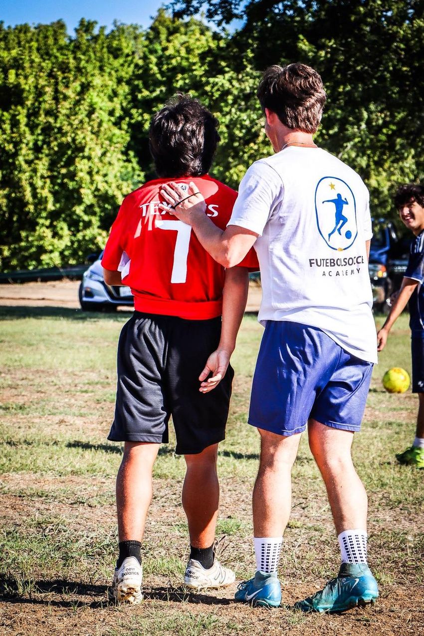 Coach explaining a movement to a player one on one